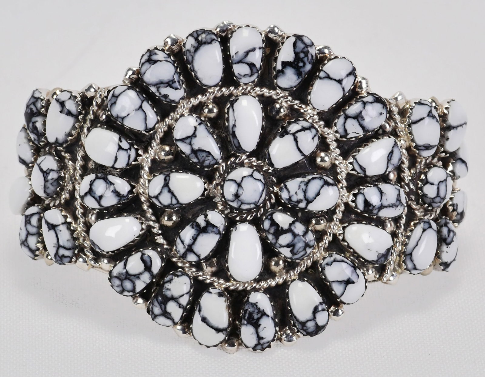Juliana Williams Sterling Silver Block White Buffalo Turquoise Bracelet: Sterling Silver| Juliana Williams Sterling Silver Block White Buffalo Turquoise Bracelet| Block Turquoise| Inside measures 5.5" plus a gap of 1.25" - Total 6.75"| Face Width 2"| Hallmarked "JW"| Weigh