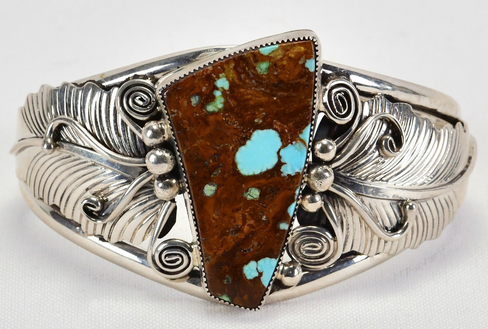 Albert Smith Sterling Silver Blue Moon Turquoise Bracelet: Sterling Silver| Albert Smith Sterling Silver Blue Moon Turquoise Bracelet| Genuine Blue Moon Turquoise| Inside measures 5.25" plus a gap of 1.25" - Total 6.5"| Face Width 1.75"| Signed| Weighs 54.6 G