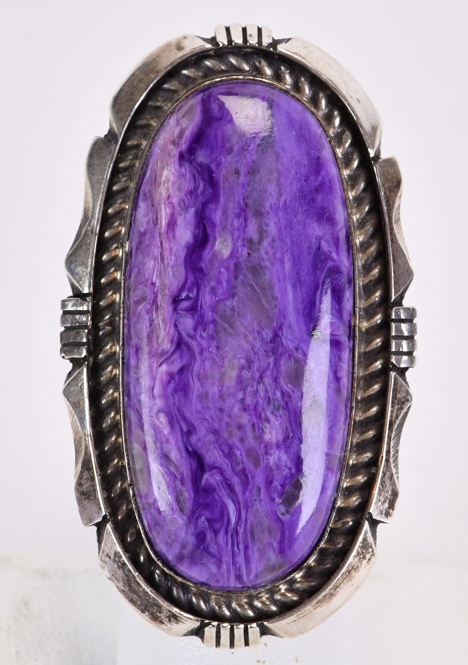 Eddie Secatero Sterling Silver Large Charoite Ring: Sterling Silver| Eddie Secatero Sterling Silver Large Charoite Ring| Genuine Charoite| Measures 2.25" Long x 1.5" Wide| Hallmarked "ES"| Weighs 42 Grams| Size 7| Native American, Navajo, Southwestern 