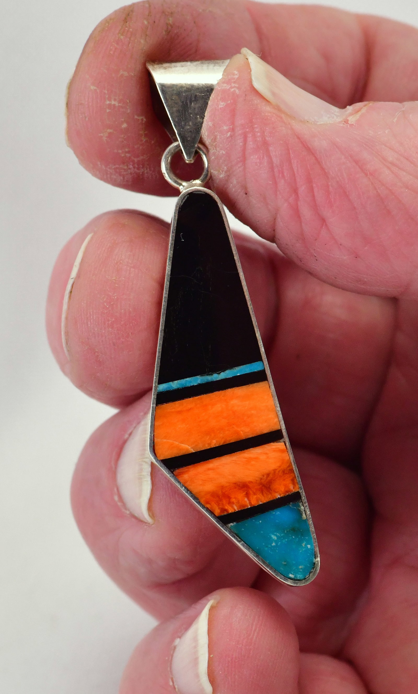 Navajo, H. Smith Sterling Silver Turquoise Spiny Oyster & Jet Pendant: Pendant Only - Sterling Silver| Navajo, H. Smith Sterling Silver Turquoise, Spiny Oyster & Jet Pendant| Genuine Turquoise, Spiny Oyster and Jet| Measures 2.5" Long x 1/2" Wide| Signed| Weighs 5.7 Gram
