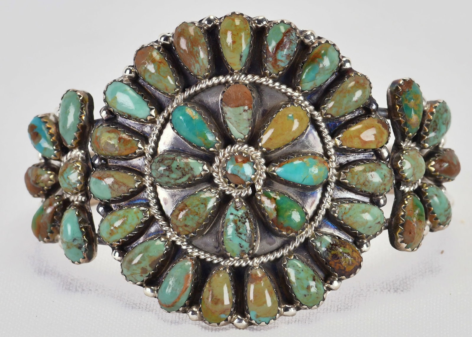Ophelia Moses Sterling Silver Kingman Turquoise Cluster Cuff: Sterling Silver| Ophelia Moses Sterling Silver Kingman Turquoise Cluster Cuff| Genuine Kingman Turquoise| Inside measures 5.25" plus a gap of 1.25" - Total 6.5"| Face Width 1.75"| Hallmarked "OM"| Wei