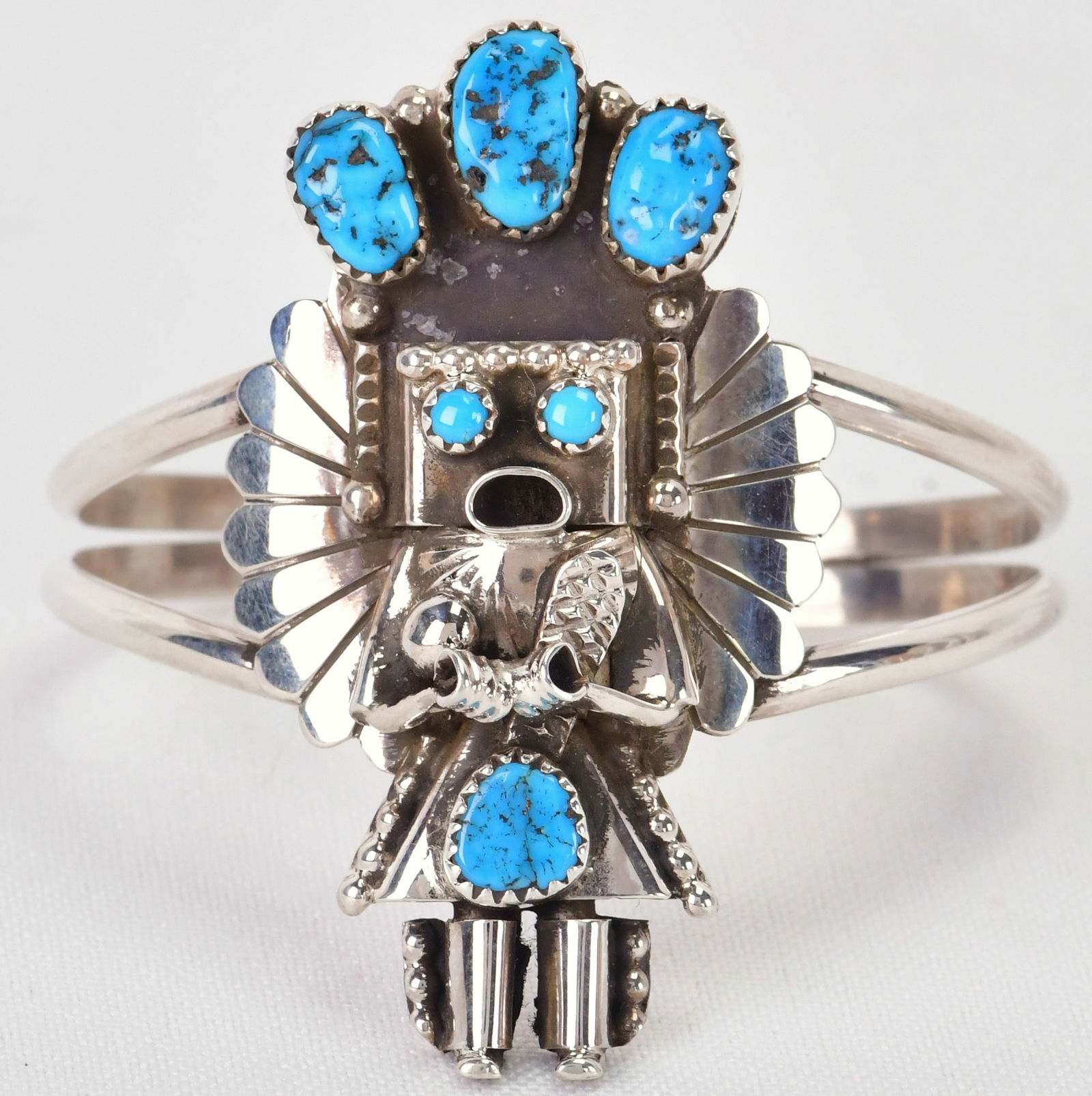 Doris Smallcanyon Sterling Silver Kingman Turquoise Kachina Cuff: Sterling Silver| Doris Smallcanyon Sterling Silver Kingman Turquoise Kachina Cuff Bracelet| Genuine Kingman Turquoise| Inside measures 5.75" plus a gap of 1.25" - Total 7"| Face Width 2.25"| Hand Sign