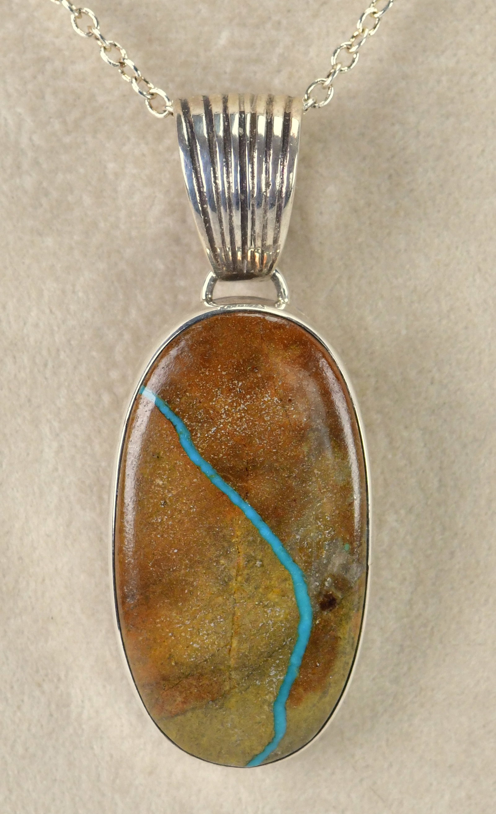 Native American Sterling Silver Boulder Turquoise Pendant: Pendant Only - Sterling Silver| Native American Sterling Silver Boulder Turquoise Pendant| Genuine Boulder Turquoise| Measures 2" Long x 3/4" Wide| Hallmarked "SH"| Weighs 11 Grams| Native American, N