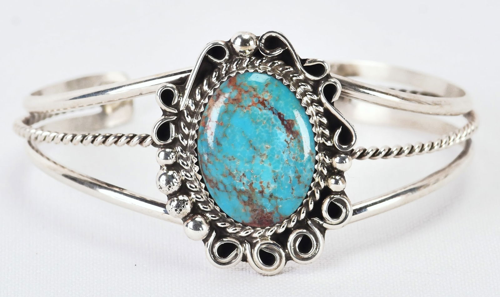 Native American Sterling Silver Lone Mountain Turquoise Cuff: Sterling Silver| Native American Sterling Silver Lone Mountain Turquoise Cuff| Genuine Lone Mountain Turquoise| Inside measure 5.75" plus a gap of 1" - Total 6.75"| Face Width 1 3/8"| Unsigned| Weighs