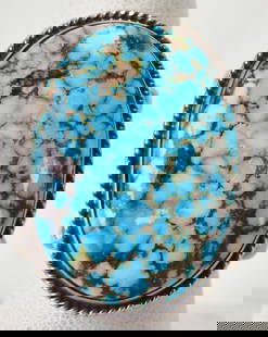 Darrell Cadman Sterling Silver Spiderweb Turquoise Ring: Sterling Silver| Darrell Cadman Sterling Silver Spiderweb Turquoise Ring| Genuine High Grade Spiderweb Turquoise| Measures 1 3/8" Long x 1" Wide| Has Domed Mounting and Ornate Band| Signed| Weighs 24.