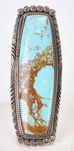 Phillip Yazzie Sterling Silver Huge Number 8 Turquoise Long Ring: Sterling Silver| Phillip Yazzie Sterling Silver Huge Number 8 Turquoise Ring| Genuine Number 8 Turquoise| Measures 3" Long x 1.25" Wide| Stone is Chunky and sits about ring mounting| Hallmarked "PY"|