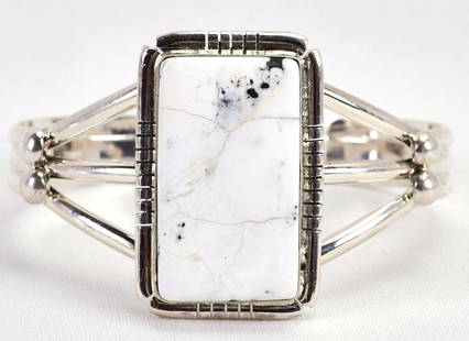 Navajo Sterling Silver White Buffalo Turquoise Cuff Bracelet: Sterling Silver| Navajo Sterling Silver White Buffalo Turquoise Cuff Bracelet| Genuine White Buffalo Turquoise| Inside measures 5.5" plus a gap of 1.25" - Total 6.75"| Face Width 1.5"| Hallmarked "SE"