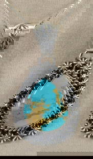 Native American Sterling Nevada Turquoise Pendant w/Star Concho Frame: Pendant Only - Sterling Silver| Native American Sterling Silver Nevada Turquoise w/Star Concho Frame| Genuine Nevada Turquoise| Measures 2.25" Long x 1.25" Wide| Hallmarked "DR"| Weighs 16.4 Grams| Na