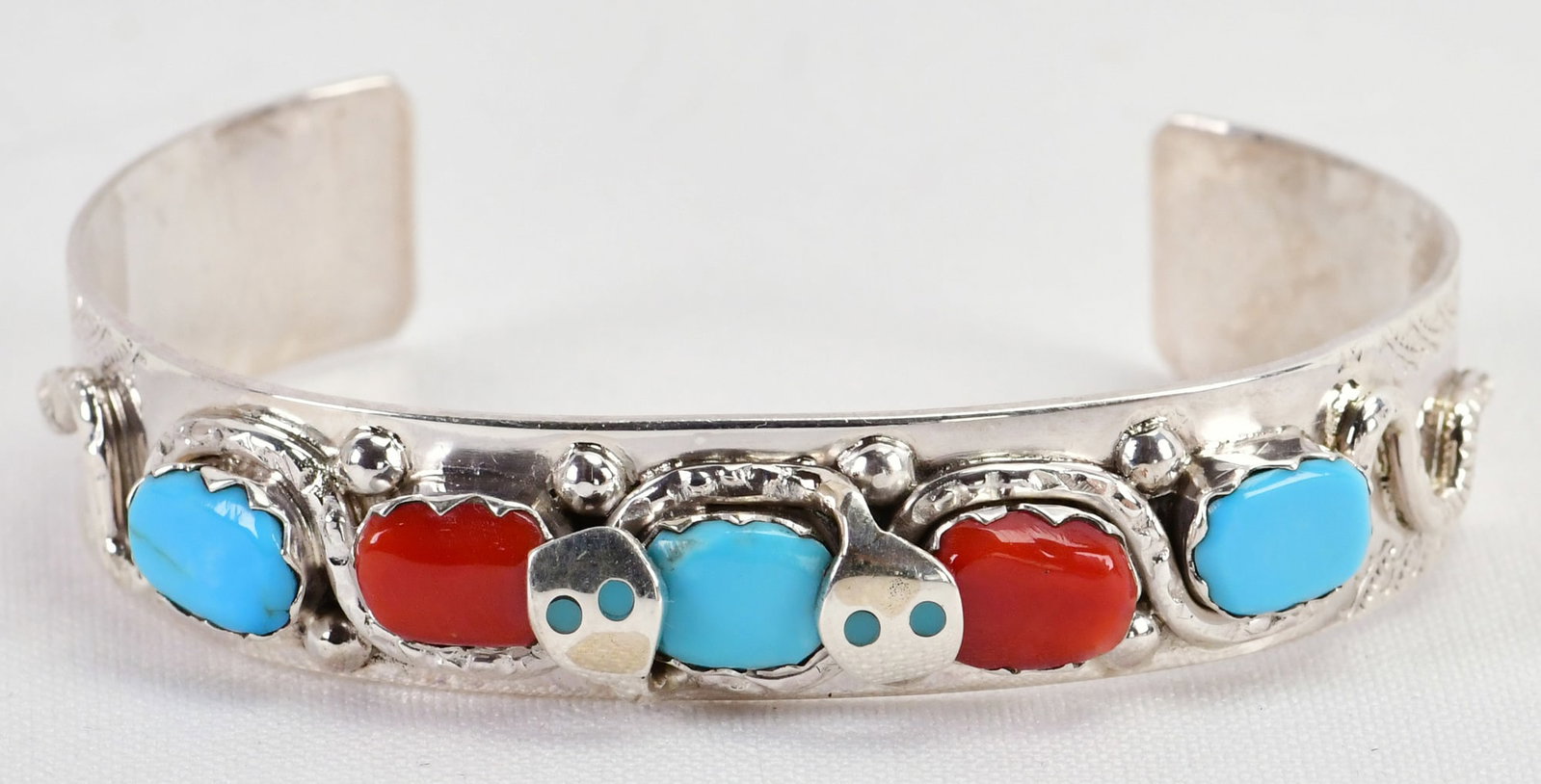 Effie Calavaza Sterling Silver Turquoise & Coral Snake Bracelet: Sterling Silver| Effie Calavaza Sterling Silver Turquoise and Coral Snake Bracelet| Genuine Turquoise, Genuine Turquoise| Inside measures 5.25" plus a gap of 1.25" - Total 7"| Face Width 1/2"| Signed|
