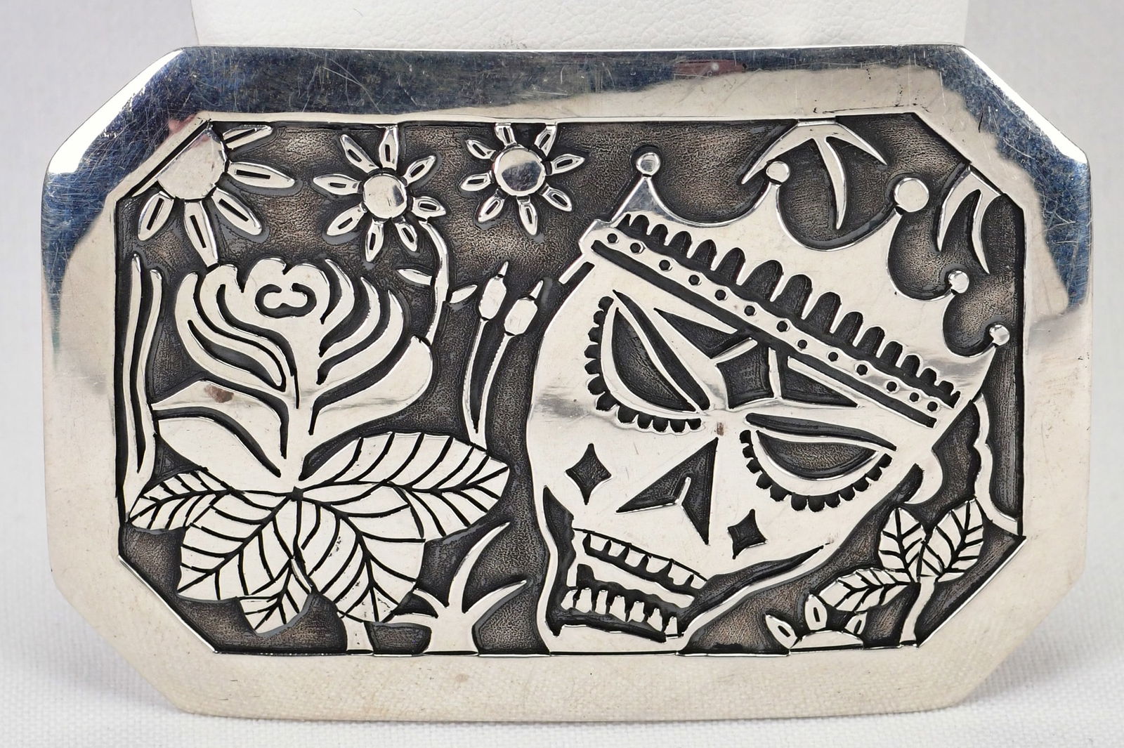 Navajo, Sonny Gene Sterling Silver Overlay Mardi-Gras Belt Buckle: Sterling Silver| Navajo, Sonny Gene Sterling Silver Overlay Mardi-Gras Belt Buckle| All Sterling Silver| Measures 3" Long x 2" Wide| Has Wonderful Overlay detail work.| Siberian Iris with Skull and Cr