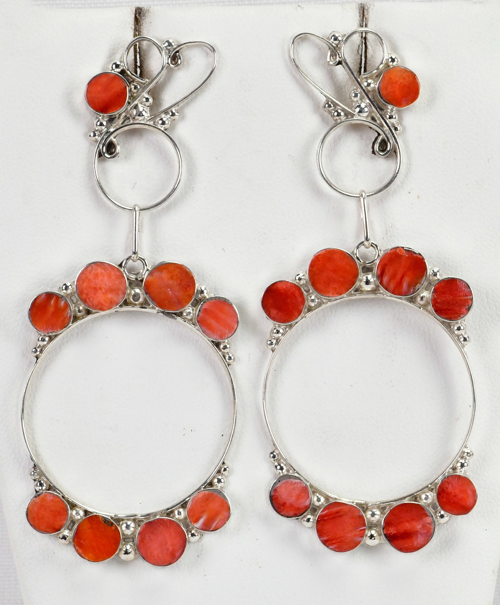 Zuni, Unique Design Sterling Silver Spiny Oyster Flush Inlay Earrings: Sterling Silver| Zuni, Unique Design Sterling Silver Spiny Oyster Flush Inlay Earrings| Genuine Spiny Oyster| Measures 3" Long x 1.25" Wide| Unique Scroll Pattern| Hand Signed in Script| Weigh 13 Gram