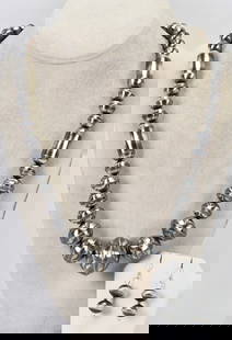 Native American Sterling Silver Bench Bead Necklace Set: Sterling Silver| Native American Sterling Silver Bench Bead Necklace Set| All Sterling Silver| This is a Hand made necklace with 2 part beads which measures 24" Long| The Beads range in size from 10 m