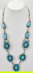 Gilbert Tom Sterling Silver Kingman Turquoise Cluster Necklace: Sterling Silver| Gilbert Tom Sterling Silver Kingman Turquoise Cluster Necklace| Genuine Kingman Turquoise| Measures 30.5" in length without the Center drop| Hand Made Sterling Chain| Has 5 Cluster pi