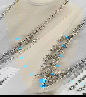 George & Lupeta Leekity Sleeping Beauty Turquoise Squash Blossom Necklace Set: George & Lupeta Leekity Sleeping Beauty Turquoise Squash Blossom Necklace Set| Genuine Sleeping Beauty Turquoise| Done in a Contemporary style Measures 24" Long {Without the center pendant}| This piec