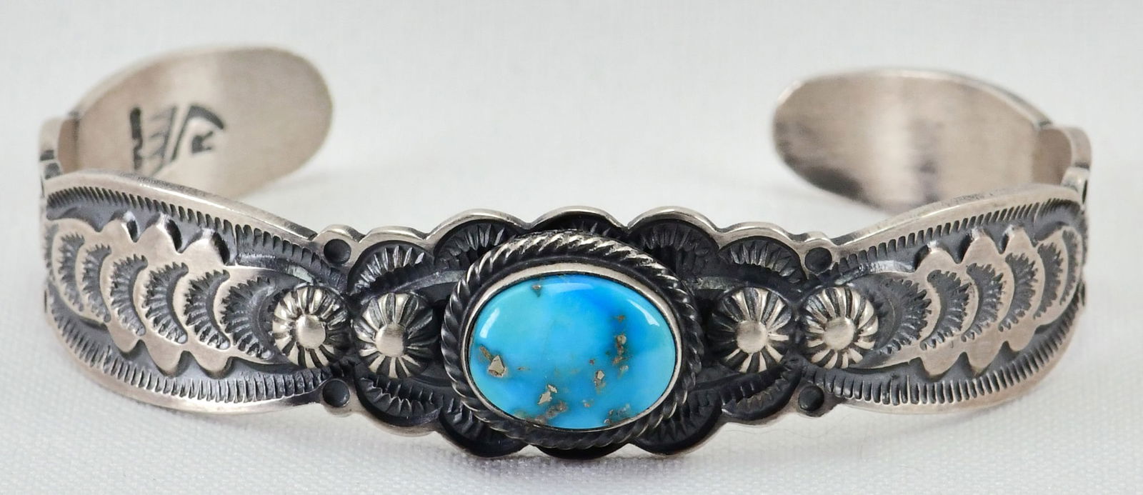 Ernest Rangel Sterling Silver Egyptian Turquoise Stamped Cuff: Sterling Silver| Ernest Rangel Sterling Silver Egyptian Turquoise Stamped Cuff| Genuine Egyptian Turquoise| Inside measures 5.5" plus a gap of 1" - Total 6.5"| Face Width 1/2"| Hallmarked| Weighs 21.9