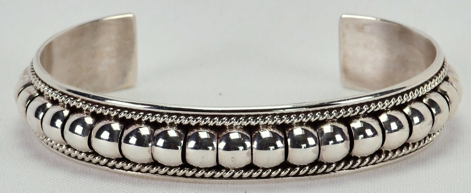 Thomas Charley Sterling Silver Bead Band Bracelet: Sterling Silver| Thomas Charley Sterling Silver Bead Band Bracelet| All Sterling Silver| Inside measures 5.25" plus a gap of 1.25" - Total 6.5"| Face Width 1/2"| Hallmarked "TC"| Weighs 18.8 Grams| Na