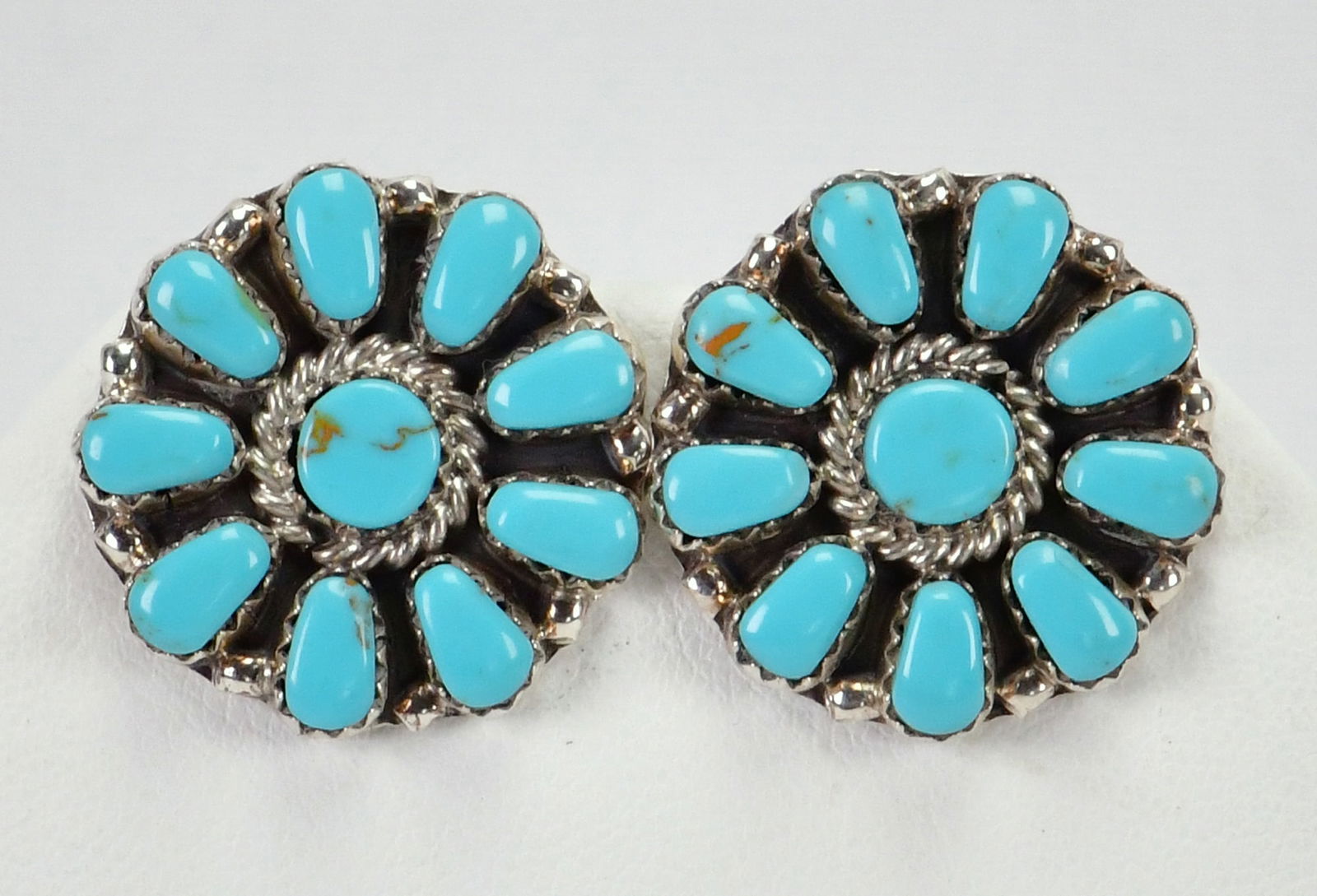 Navajo, Sterling Silver Kingman Turquoise Button Cluster Earrings: Sterling Silver| Navajo, Sterling Silver Kingman Turquoise Button Earrings| Genuine Kingman Turquoise Done in a Cluster Design| Measures 1" in diameter| Hallmarked "JB"| Weigh 8 Grams| Native American
