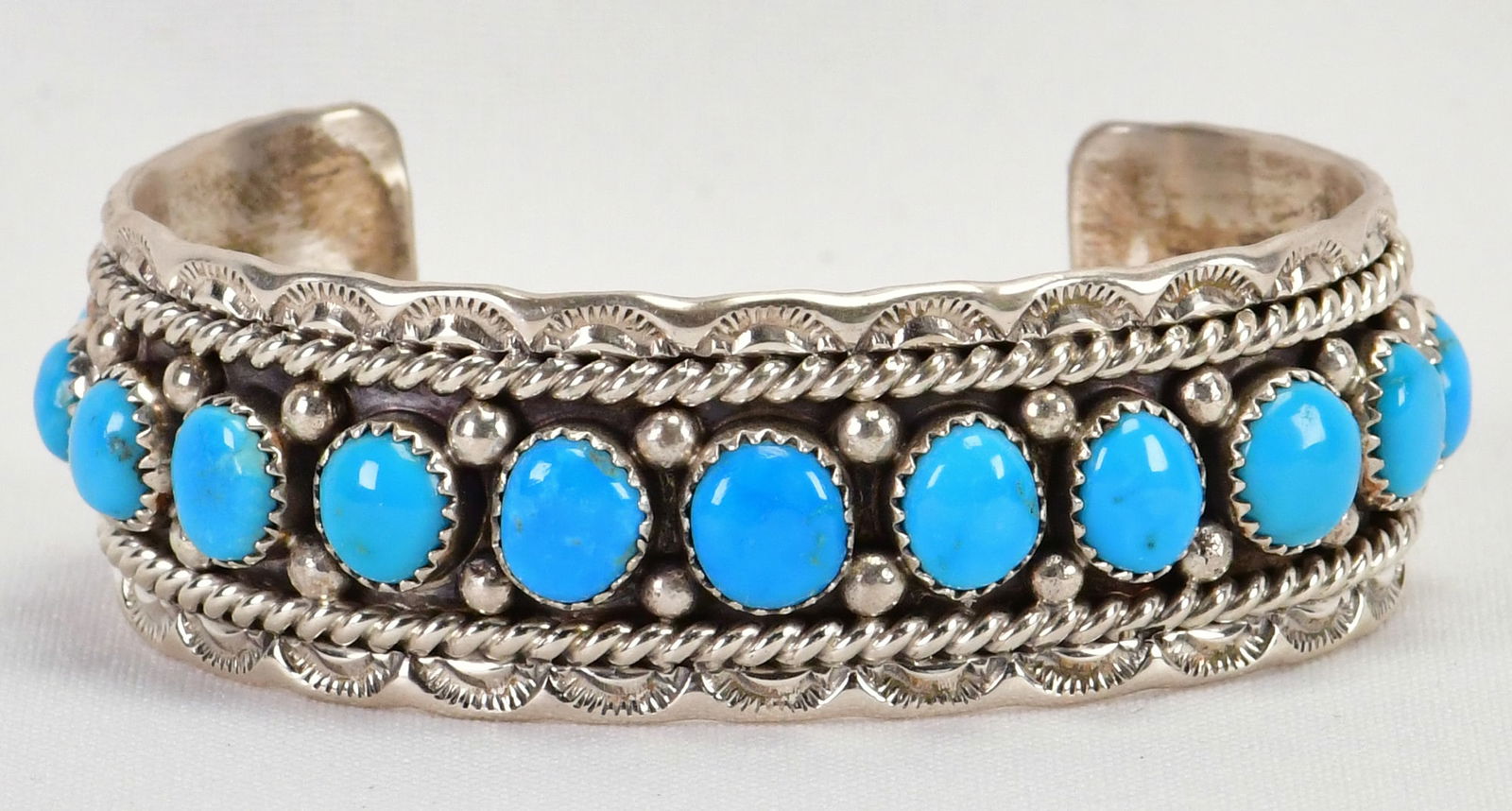 Chris Charley Sterling Silver Sleeping Beauty Turquoise Bracelet: Sterling Silver| Chris Charley Sterling Silver Sleeping Beauty Turquoise Bracelet| Genuine Sleeping Beauty Turquoise| Bracelet has 15 polished Stones across the top| Inside measures 5.5" plus a gap of