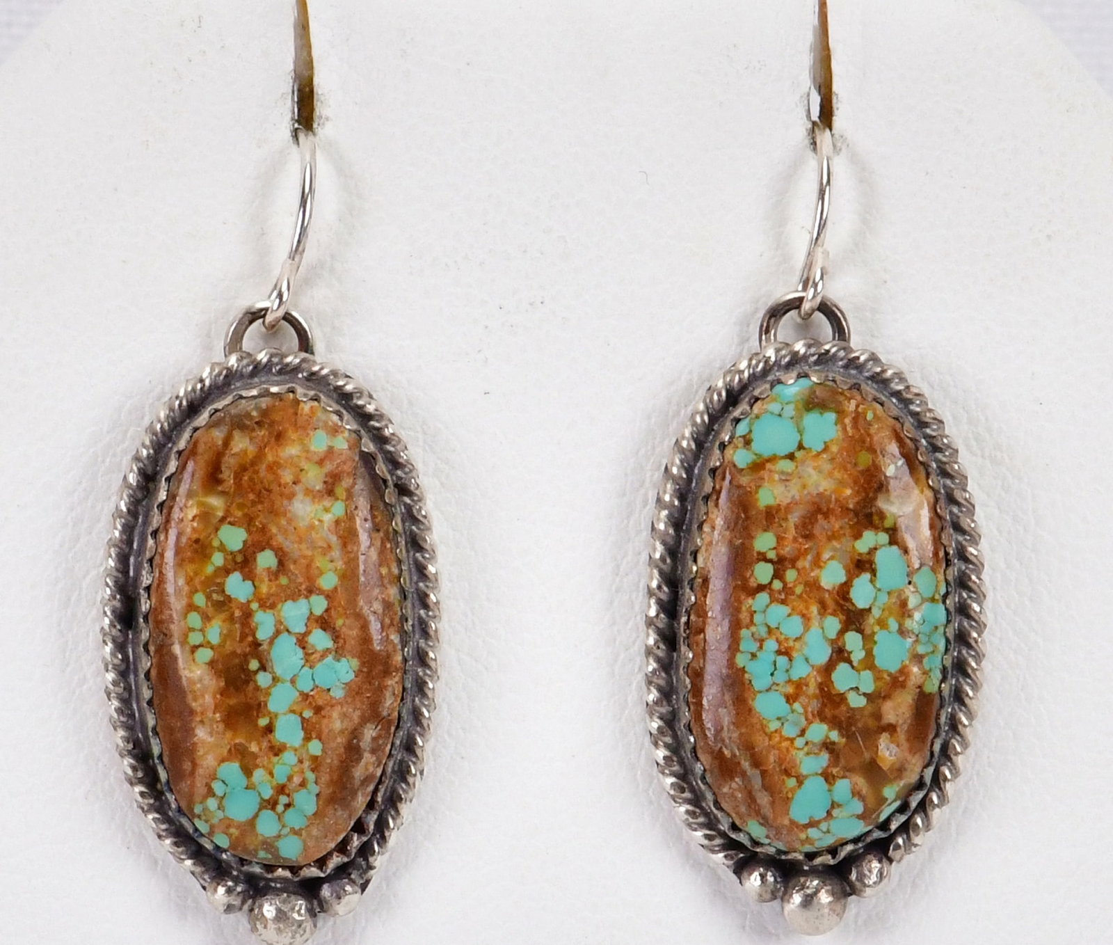 Vintage, Virginia Becenti Sterling Number 8 Turquoise Earrings: Sterling Silver| Vintage, Virginia Becenti Sterling Silver Number 8 Turquoise Earrings| Genuine Number 8 Turquoise| Measures 1.5" Long x 3/4" Wide| Done in a Simple drop style with Rope and Bead frame