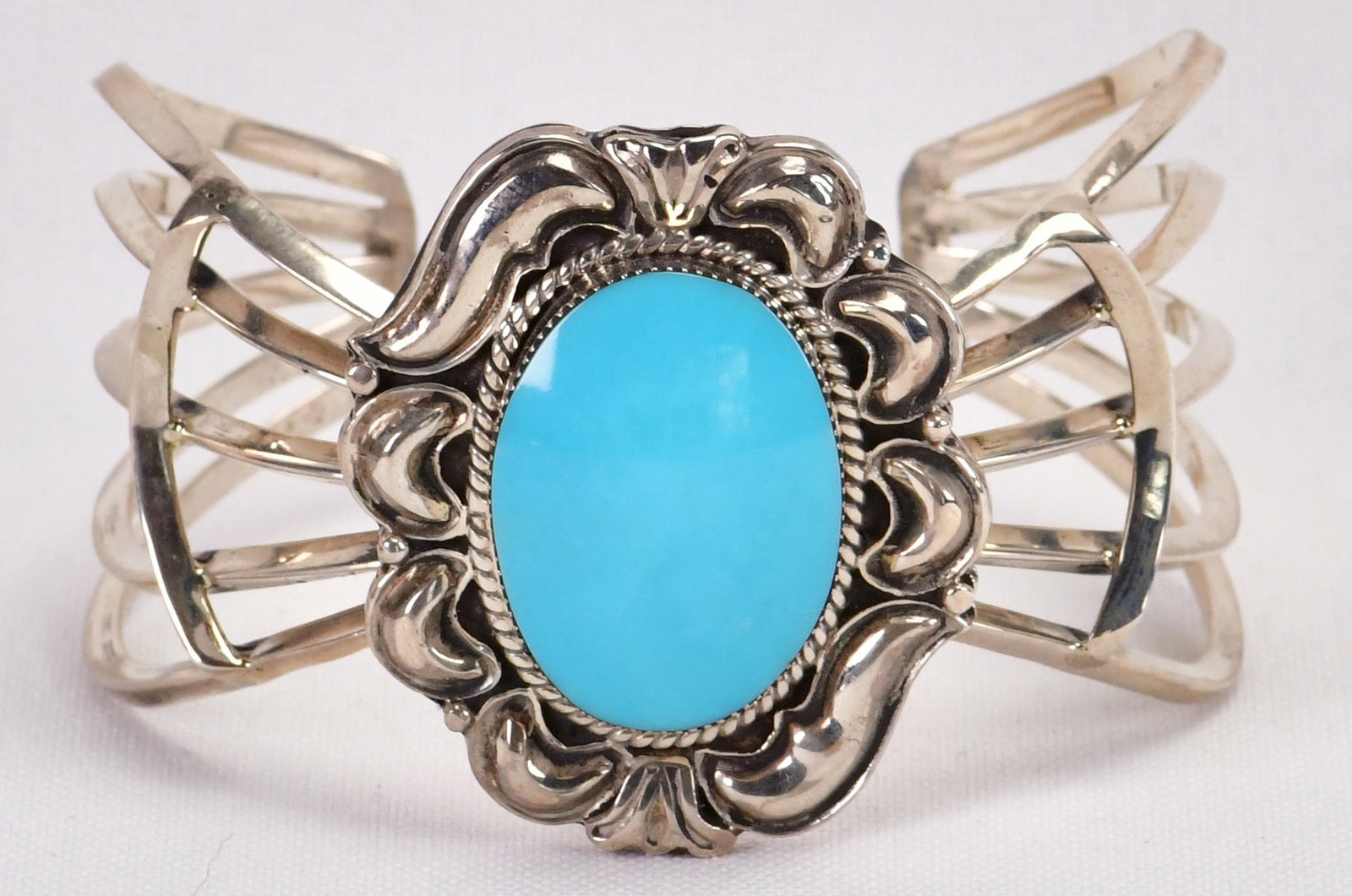 Native American Sterling Silver Harcross Turquoise Bracelet: Sterling Silver| Native American Sterling Silver Harcross Turquoise Bracelet| Genuine Harcross Turquoise| Inside measures 5.25" plus a Gap of 1.25" - Total 6.5"| Face Width 1 5/8"| Has elaborate Split