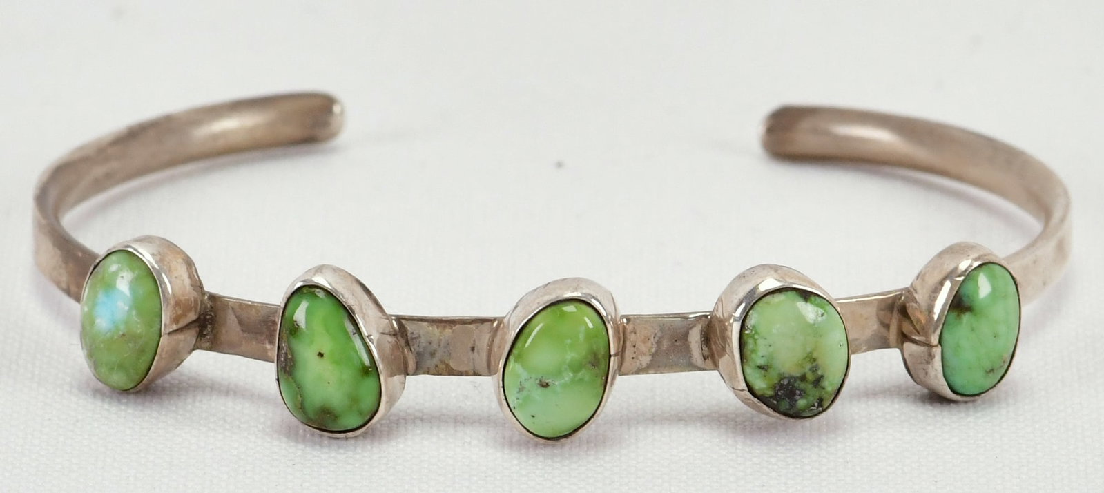 Geraldine James Sterling Silver Sonoran Gold 5 Stone Stacker Cuff: Sterling Silver| Geraldine James Sterling Silver Sonoran Gold 5 Stone Stacker Cuff Bracelet| Genuine Sonoran Gold Turquoise| Inside measures 5.5" plus a gap of 1.25" - Total 6.75"| Face Width 1/4"| Si