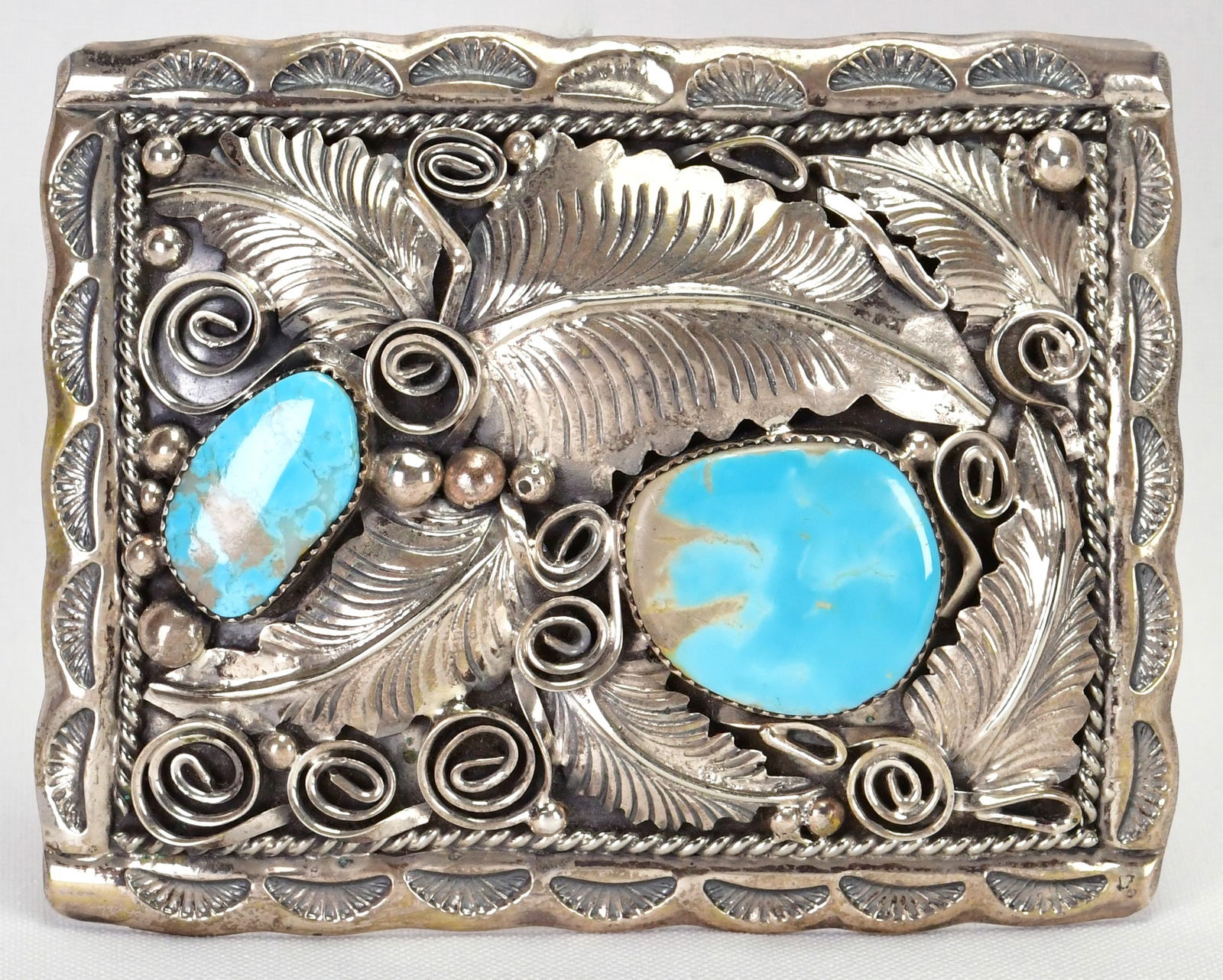 Navajo Fox Turquoise Sterling Silver Belt Buckle w/Ornate Design by Mike Thomas, Jr.: Sterling Silver| Navajo, Fox Turquoise Sterling Silver Belt Buckle w/Ornate Design by Mike Thomas, Jr.| Genuine Fox Turquoise| Measures 3.5" Wide x 3" Tall| Signed| Weighs 87.7 Grams| Keeper measures