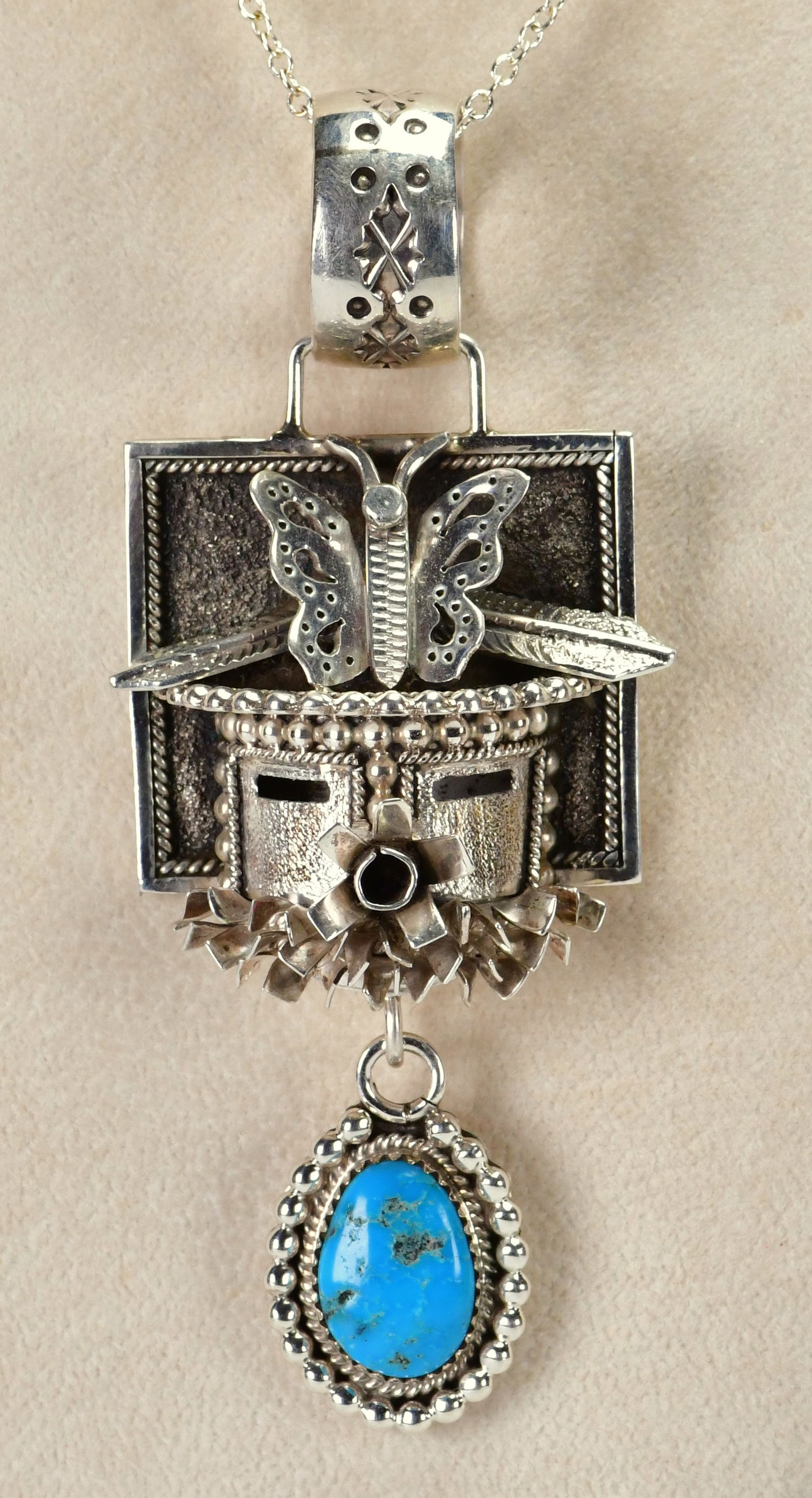 Wilford Begay Sterling Silver Kachina Pendant w/Turquoise Drop: Pendant Only - Sterling Silver| This is an Unusual piece which we were lucky to find| Wilford Begay Sterling Silver Kachina Pendant w/Turquoise Drop| Genuine Turquoise| Measures 3.75" Long x 1.5" Wide