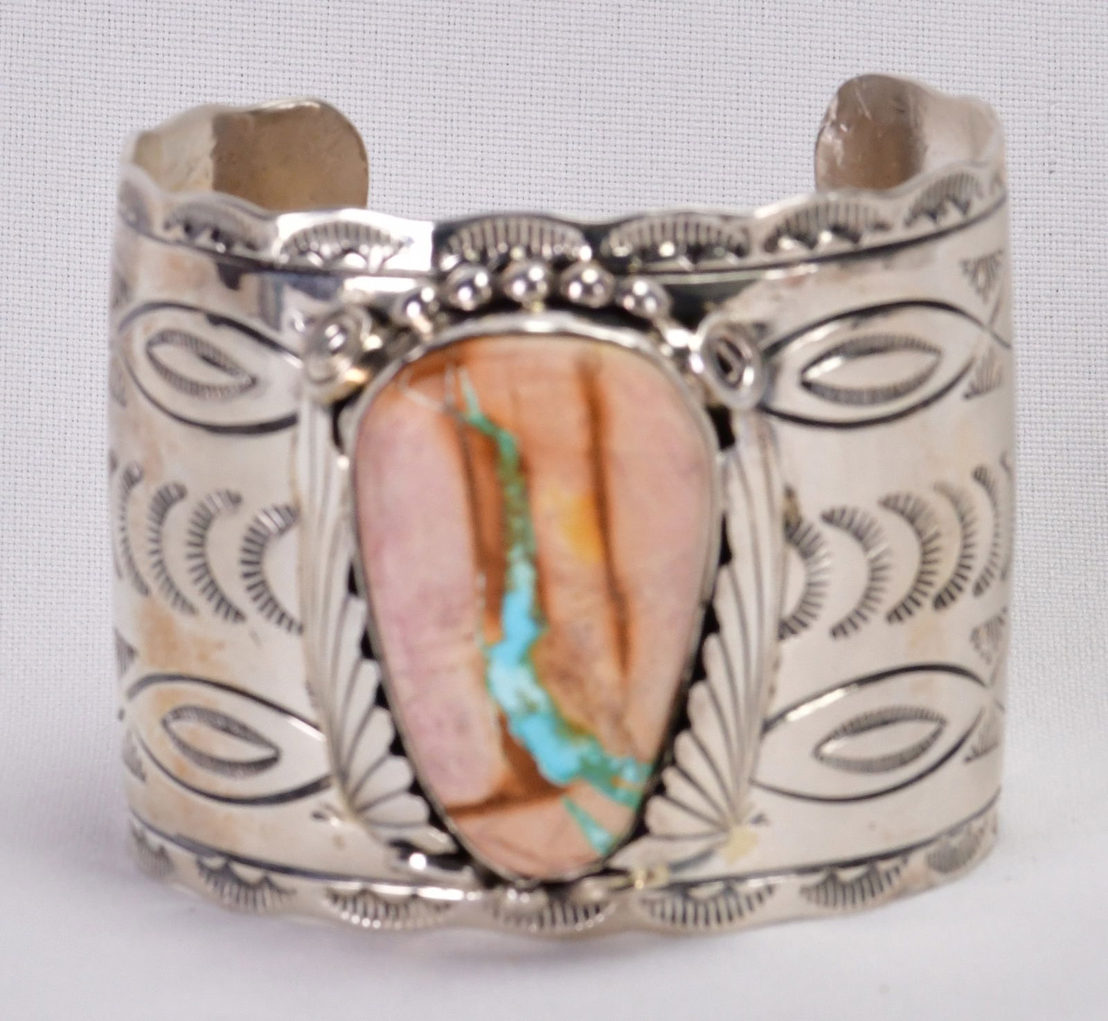 Michael Thomas, Jr. Unusual Boulder Turquoise Large Cuff Bracelet: Sterling Silver| Michael Thomas, Jr., Unusual Boulder Turquoise Large Cuff Bracelet| This piece is so unique as the Boulder Turquoise takes on a Pinkish hue and the Blue Ribbon running through the sto