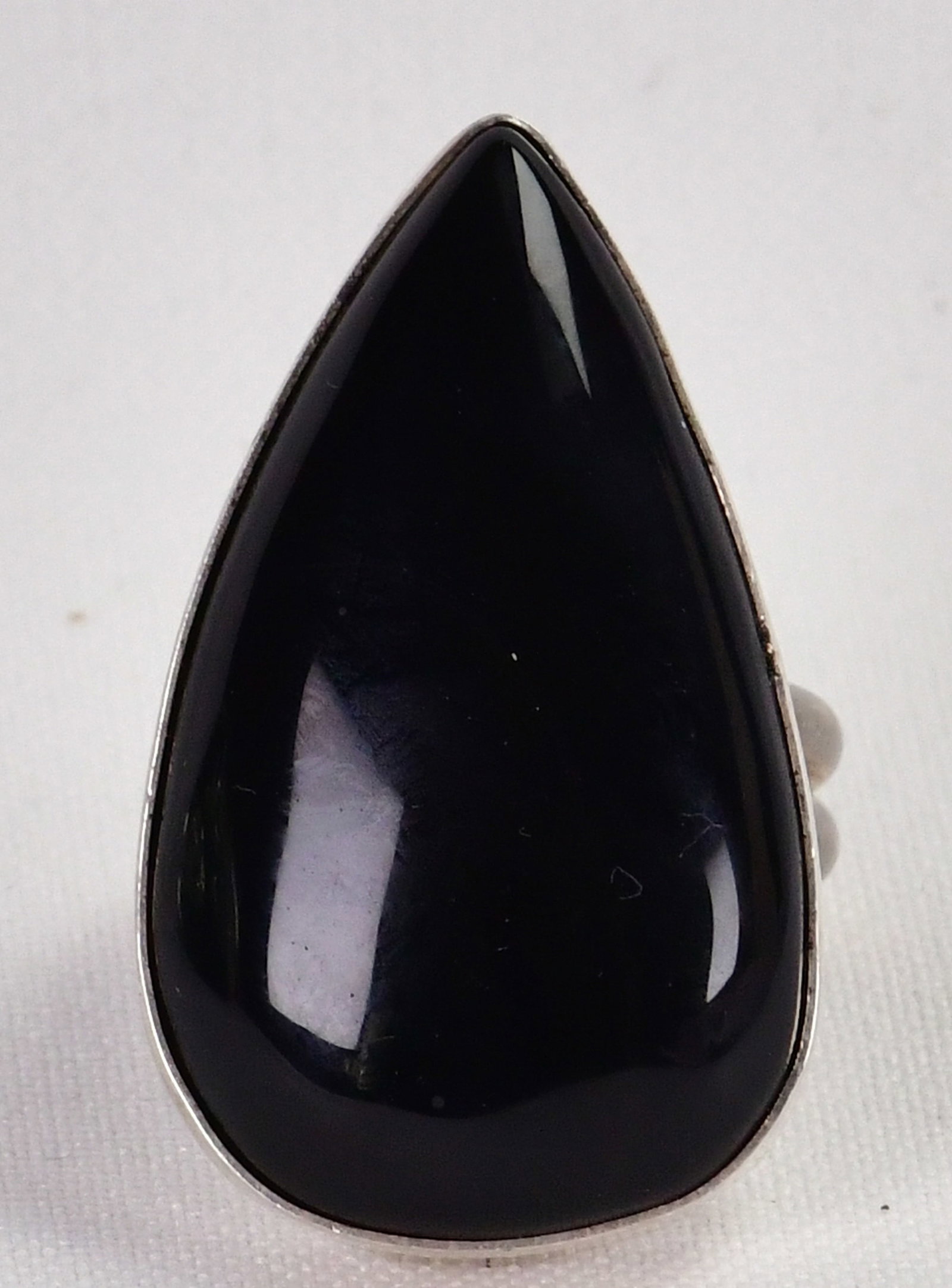 Native American Sterling Silver Black Onyx Teardrop Shape Ring - Size 8: Sterling Silver| Native American Sterling Silver Black Onyx Teardrop Shape Ring| Genuine Black Onyx| Measures 1.5"Long x 1" Wide| Hallmarked "M" and has a Double Stamp of a Hummingbird and Eagle| Weig