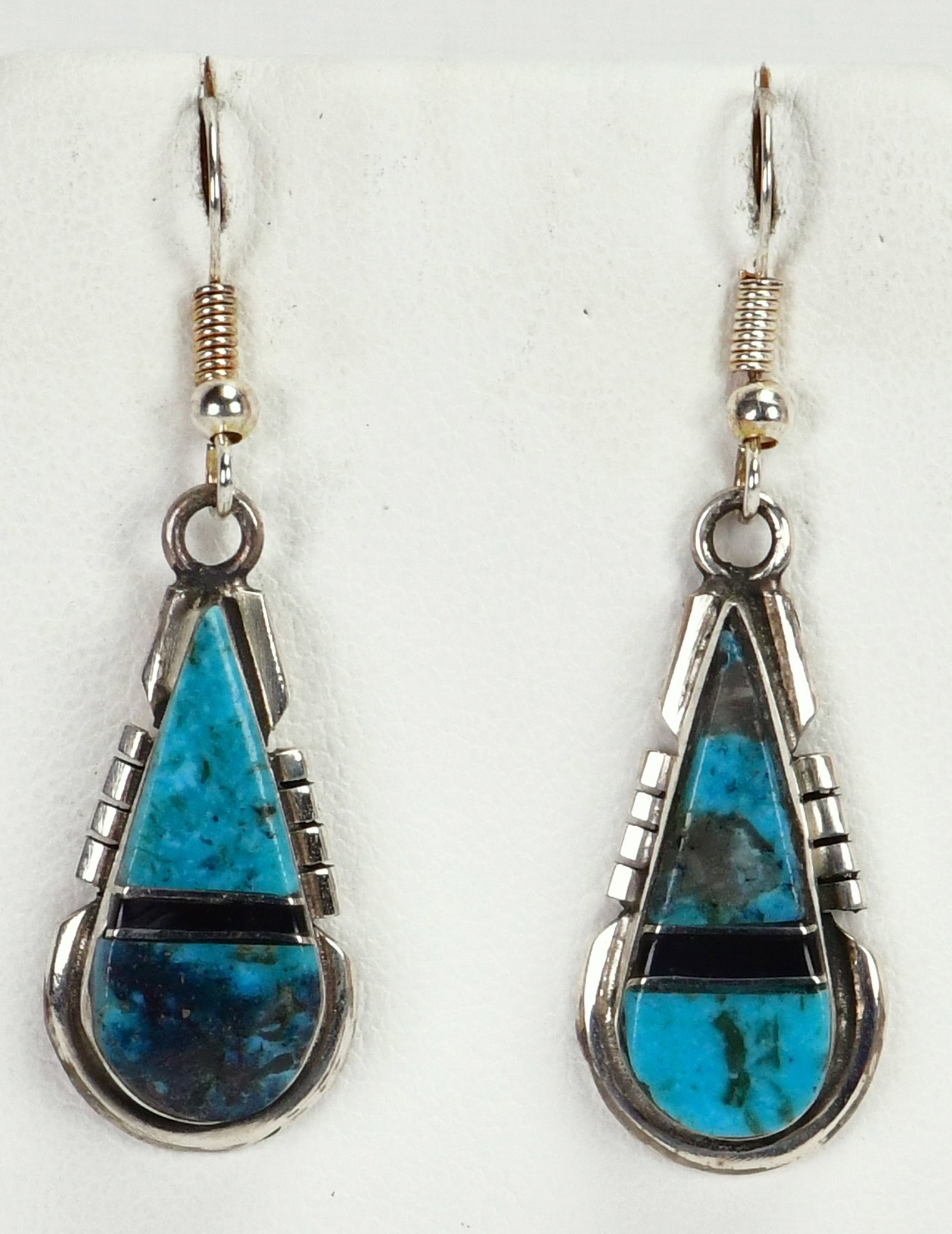 Navajo Sterling Silver Natural Turquoise and Jet Inlay Teardrop Earrings: Sterling Silver| Navajo Sterling Silver Natural Turquoise and Jet Inlay Teardrop Earrings| Genuine Turquoise, Genuine Jet| Measure 1.75" Long x 1/2" Wide| Hallmarked "RE"| Weighs 6.1 Grams| Native Ame
