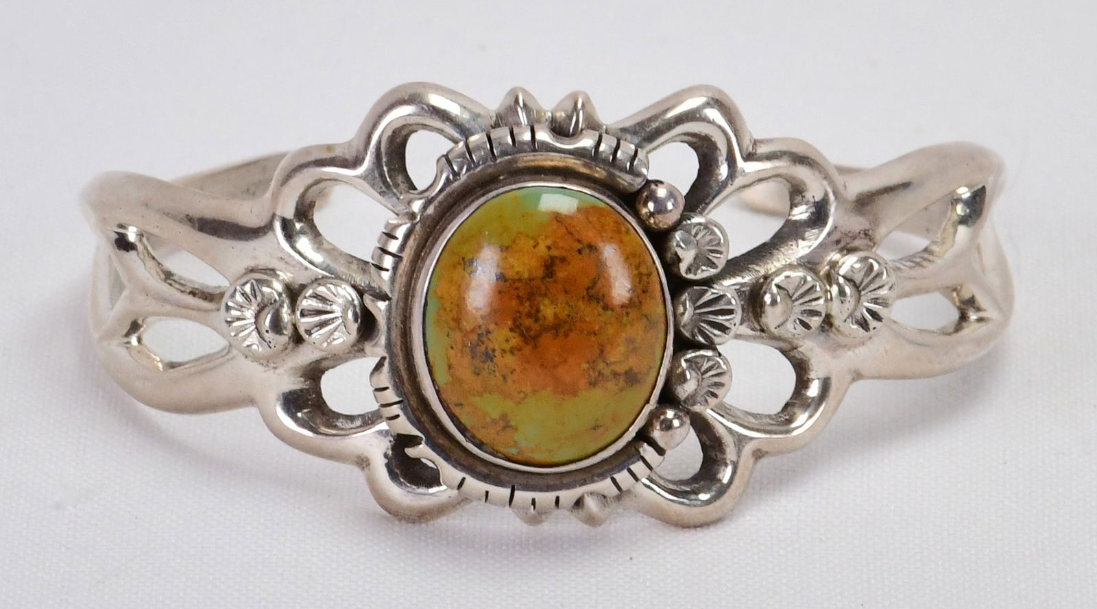 Native American Sterling Sand Cast Royston Turquoise Cuff: Sterling Silver| Native American Sterling Silver Sand Cast Royston Turquoise Cuff Bracelet| Genuine Royston Turquoise| Inside measures 6" plus a gap of 1.25" - Total 7.25"| Face Width 1.5"| Done in Sa