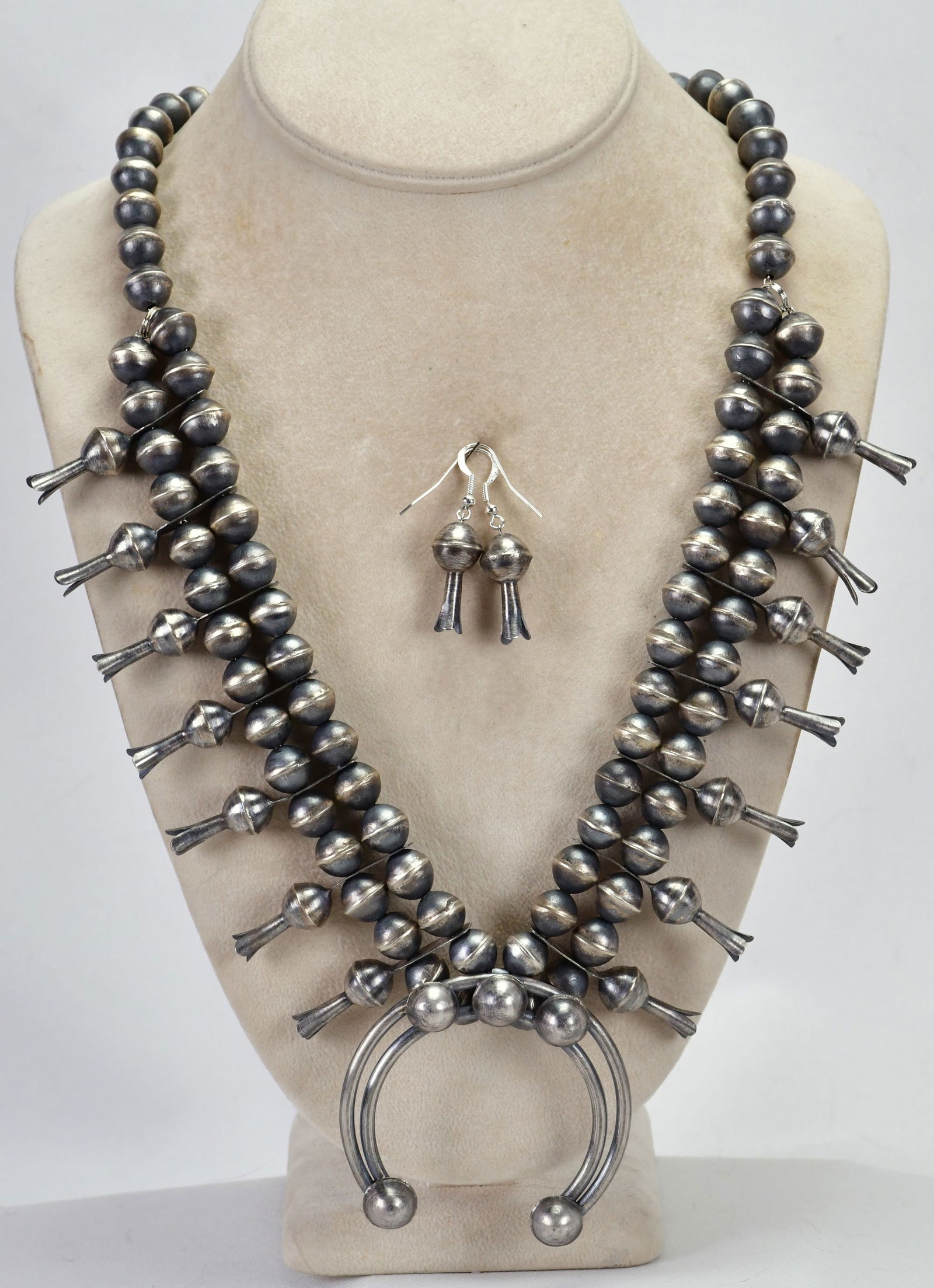 Navajo, Sterling Silver Bench Bead Squash Blossom Necklace Set: Sterling Silver| Navajo, Sterling Silver Bench Bead Squash Blossom Necklace Set| All Sterling Silver| The beads in this set are all hand made 2 Part Bench Beads| Measures 25" in Length {Without the Na