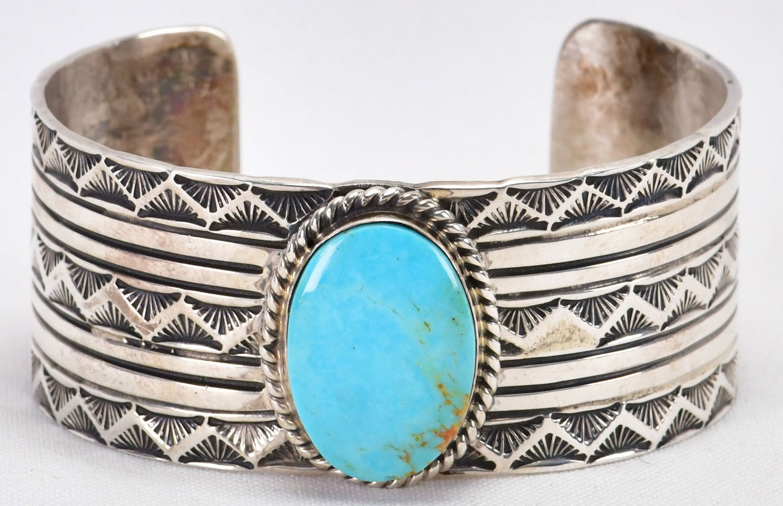 Tillie Jon Sterling Silver Blue Moon Turquoise Heavy Gauge Bracelet: Sterling Silver| Tillie Jon Sterling Silver Blue Moon Turquoise Heavy Gauge Bracelet| Genuine Blue Moon Turquoise| Inside measures 5.75" plus a gap of 1.25" - Total 5.25| Face Width 1 1/8"| Signed| We
