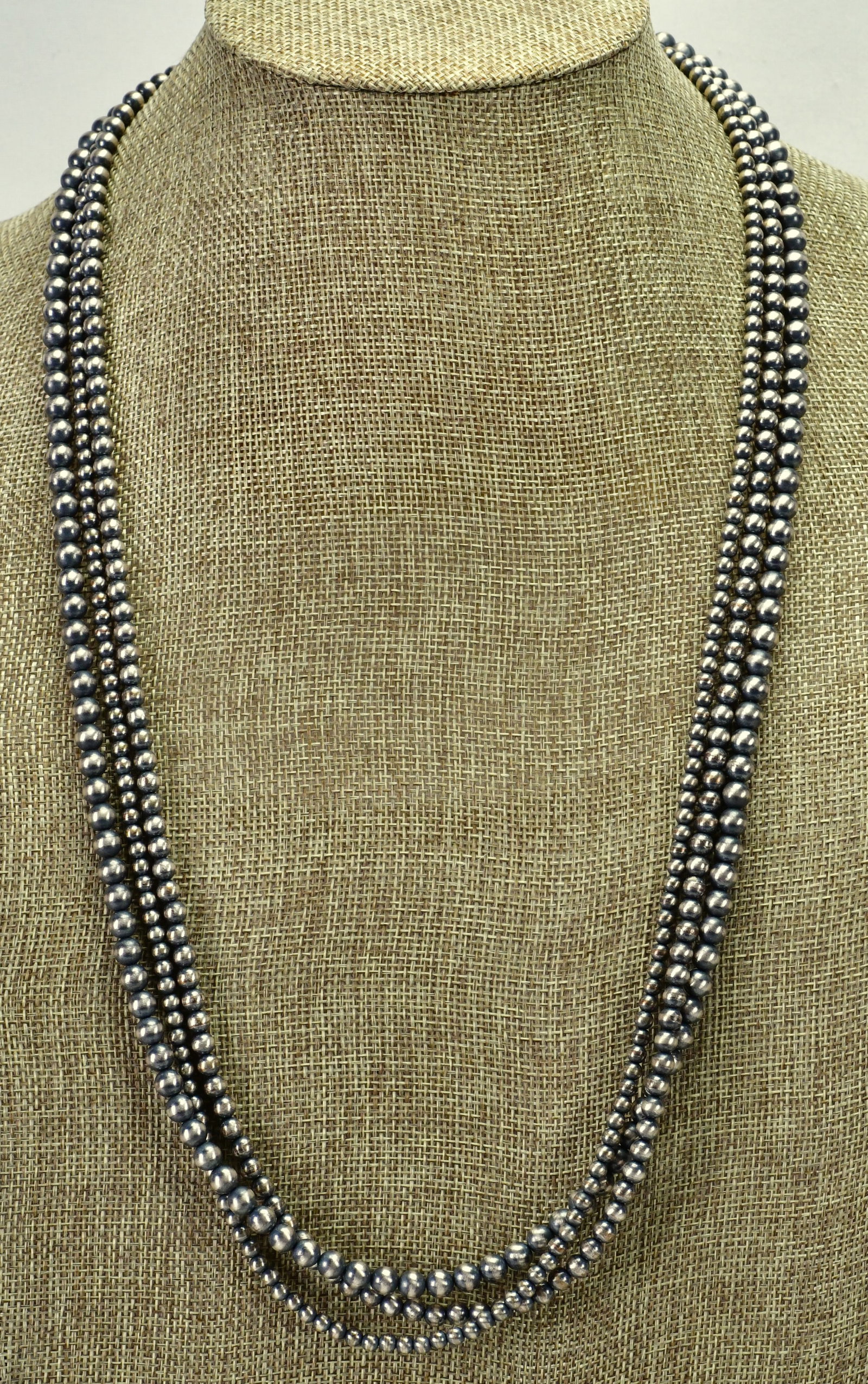 Native American 3 Strand Bench Bead Necklace - 30" Long: Native American 3 Strand Bench Bead Necklace| All Sterling Silver| Measures 30inches| 3 Strands of Bench Beads that are sizes 4-6 mm in size| End caps marked Sterling and have a "Crossroads" or "Zia"