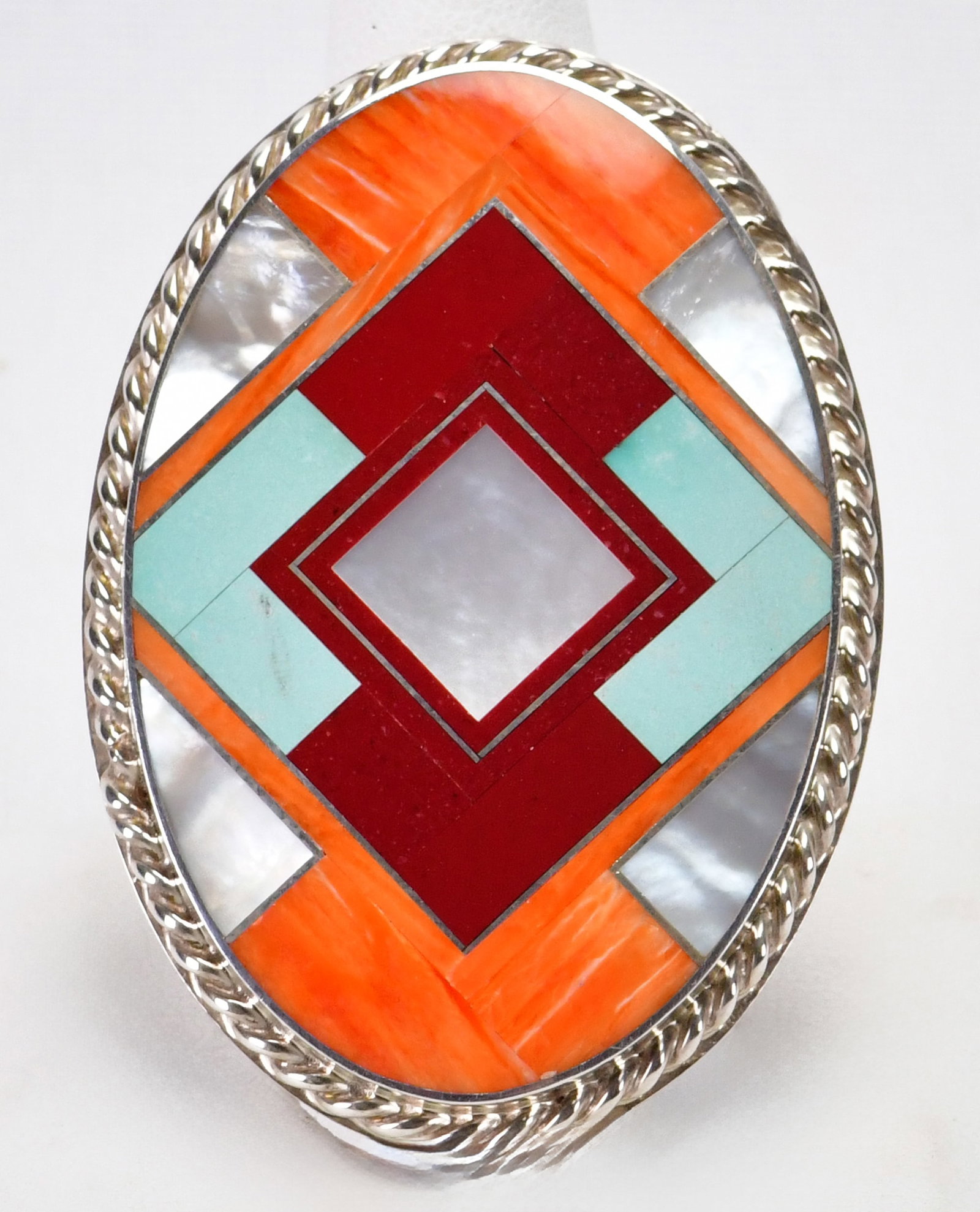 Native American Sterling Silver Large Multi-Stone Inlay Ring - Size 9.25: Sterling Silver| Native American Sterling Silver Large Multi-Stone Inlay Ring| Genuine Turquoise, Mother of Pearl, Spiny Oyster and Sugilite| Measures 2.25" Long x 1.25" Wide| Hallmarked "CM"| Weighs