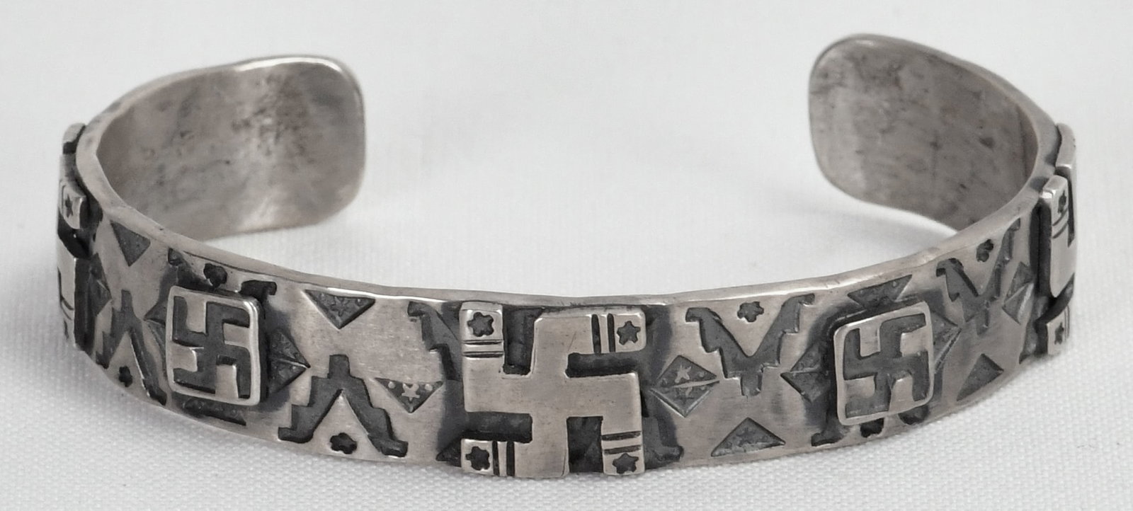 Native American Sterling Silver Whirling Log Overlay Cuff Bracelet: Sterling Silver| Native American Sterling Silver Whirling Log Overlay Cuff Bracelet| All Sterling Silver| A unique and collected style| Inside measures 5.5" plus a gap of 1.5" - Total 7"| Face Width 1