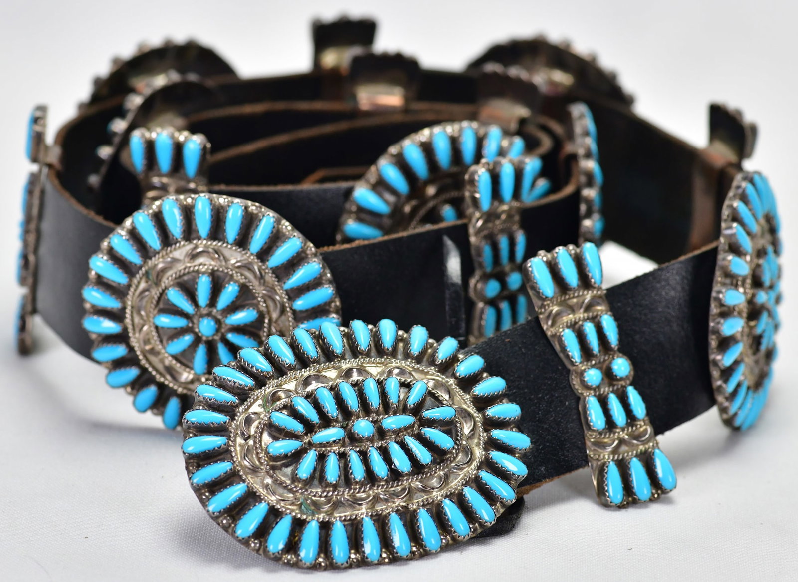 Native American, Zuni, Sterling Silver Cluster Concho Belt - 42" Long: Sterling Silver| Native American, Zuni Sterling Silver Cluster Concho Belt| Measures 42" Long and has 7 Concho Pieces, 8 Butterfly Pieces and the Buckle| Concho pieces measure 2" in Diameter| Butterfl