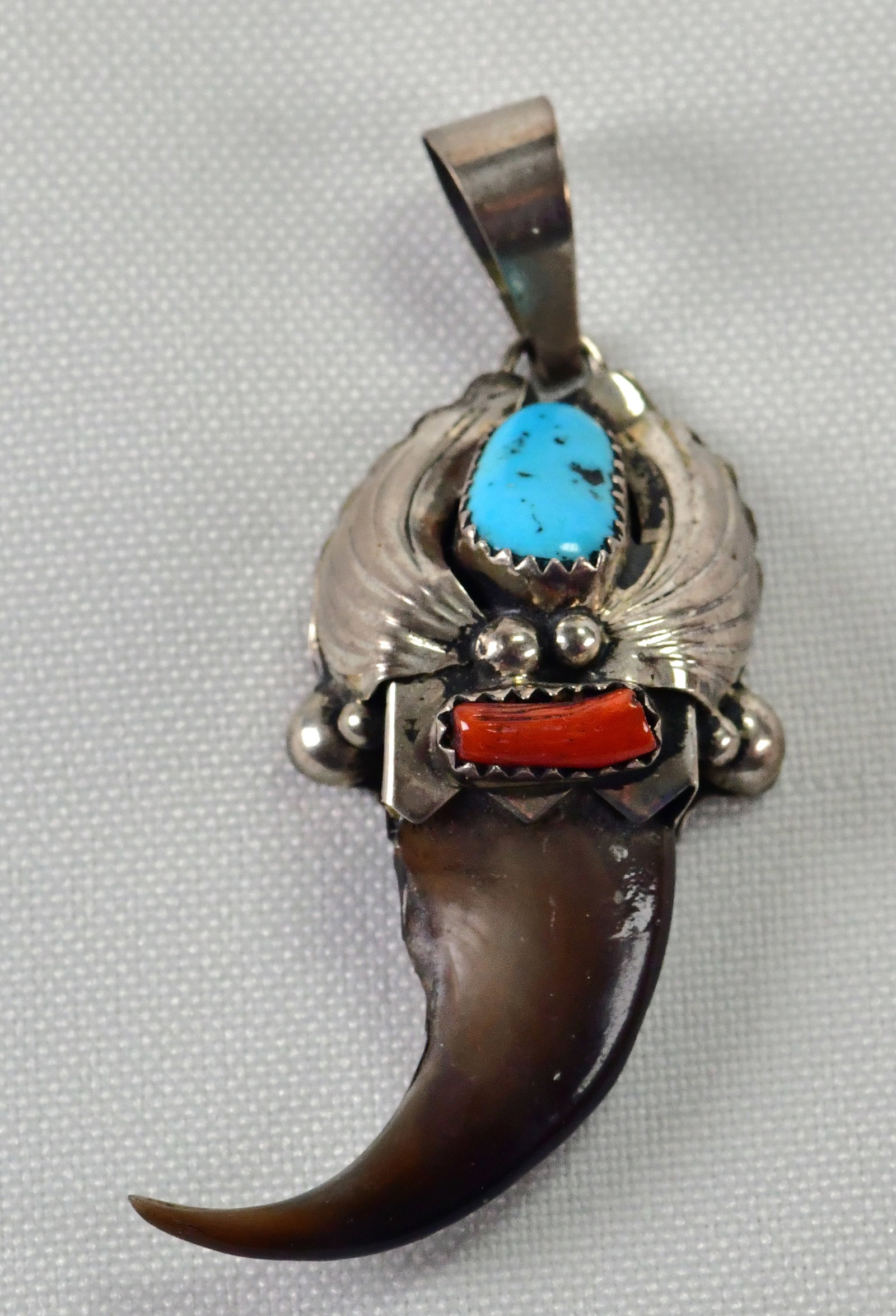 Navajo Sterling Silver Bear Claw Pendant w/Turquoise & Coral Accents: Pendant Only - Sterling Silver| Navajo Sterling Silver Bear Claw Pendant w/Turquoise & Coral accents| Genuine Coral, Genuine Turquoise| Measures 2.25" Long x 1" Wide| Hallmarked "ES"| Weighs 6.8 Grams