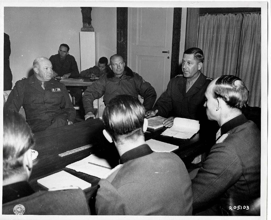 Gen. Devers & Germans at capitulation. Haar 5.5.1945: Original Authentic 1945 W.W.II. U.S. Signal Corps Photo 205103 of Nazi Surrender.General Jacob L. Devers, CG, Sixth Army Group, explains the significance of unconditional surrender to German officials