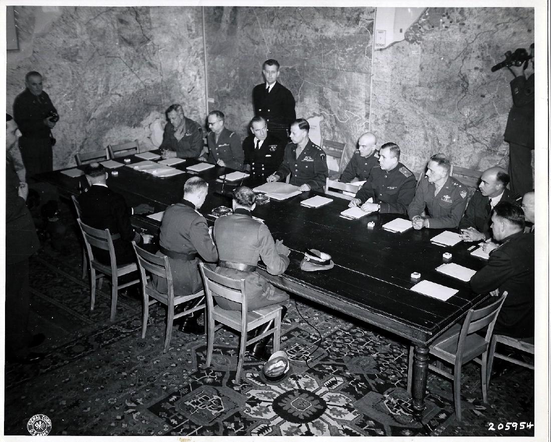 Nazi Gen. Gustaf Jodl signs capitulation. Reims 5.7.45: Original Authentic 1945 W.W.II. U.S. Signal Corps Photo 205954 of Nazi Surrender.Col. Gen. Gustaf Jodl, German Chief of Staff under Denitz regime, (center with back to camera) signs unconditional surr