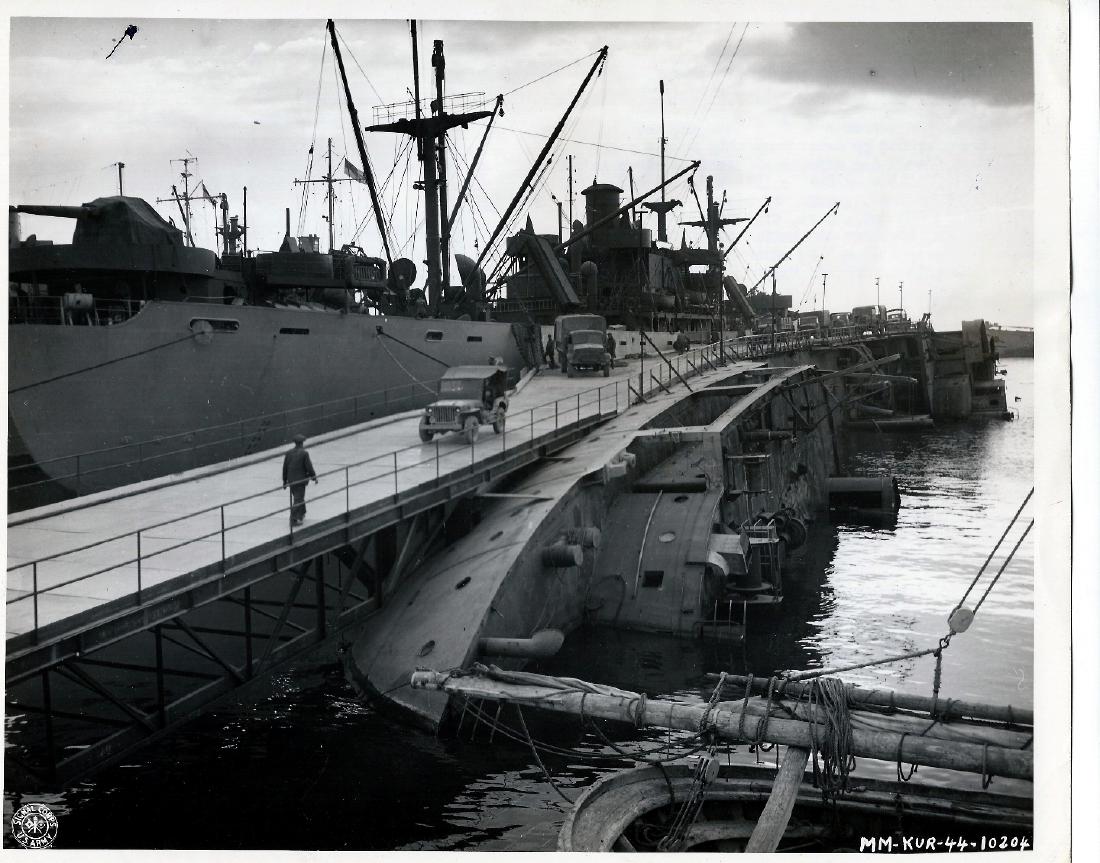 Army Engineers transformed capsized ship Italy 1.20.44: 1944 Original Authentic W.W.II. U.S. Signal Corps Photo 10204.A little thing like a capsized ship does not stand in the way of the US Army Engineers. Here, in Naples harbor, they outwitted the Nazis a