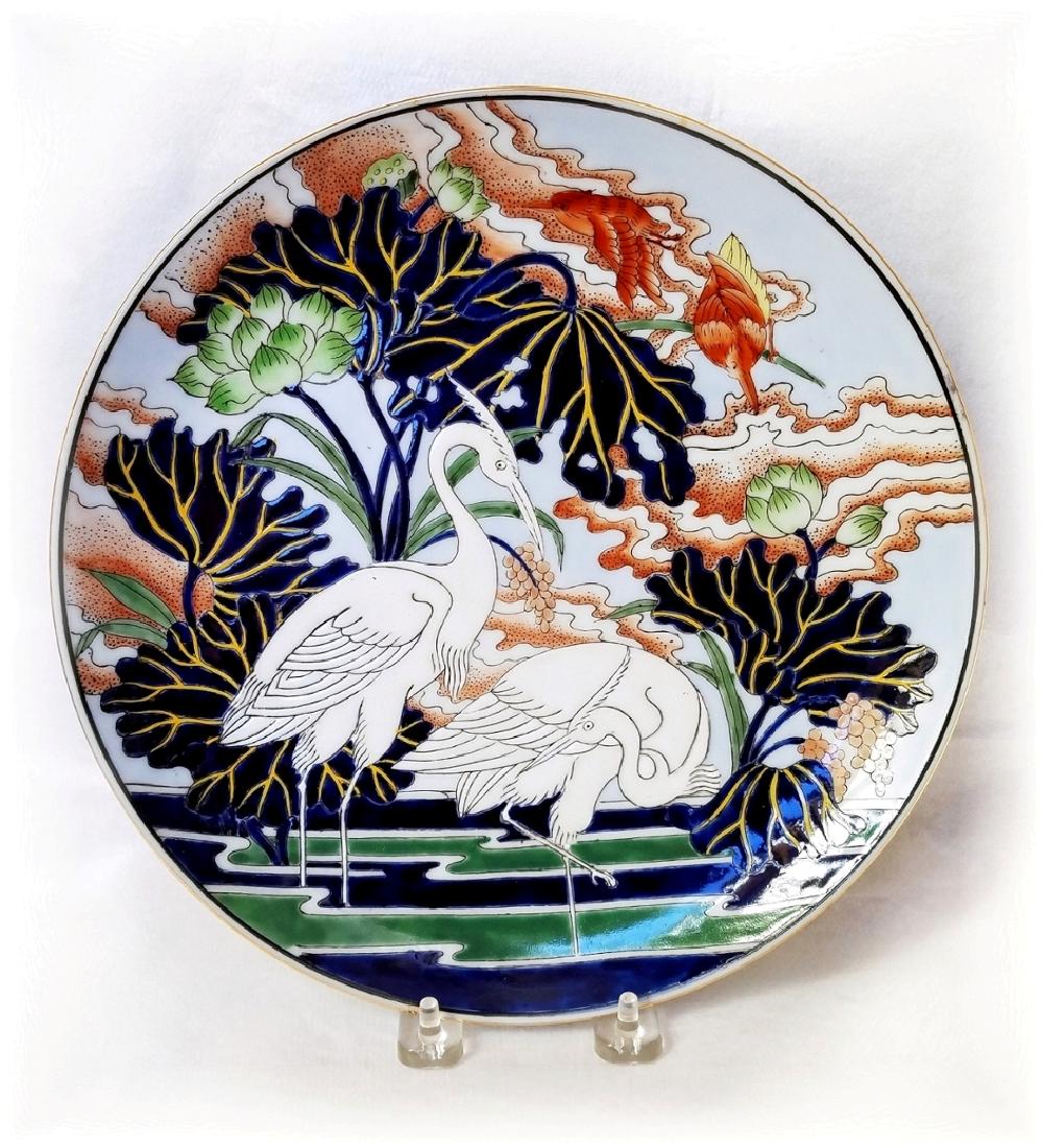 Japanese Unmarked Embossed Plate Herons on Lily Pond: Japanese Embossed Porcelain/Earthware Plate: Two Herons on Lily Pond 10.25 inches. No marks. Comparable to Toyo Porcelain. NO BUYERS PREMIUM! NOTE: This lot has a confidential reserve. When bidding pr