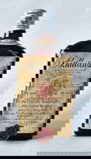 Ballantine's 1952 Liqueur Blended Scotch 4/5 Quart: Ballantine's 1952 Liqueur Blended Scotch 4/5 Quart, 86 Proof Dark glass rectangular bottle, cream label, screw cap with white capsule printed in black. Labels in place Perfect fill with no evaporation
