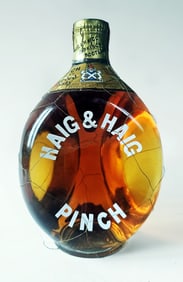 Haig & Haig Pinch Blended Finest Scots Whisky. Size 4/5 Quart, 86.8 Proof. Spring Cap Cover.