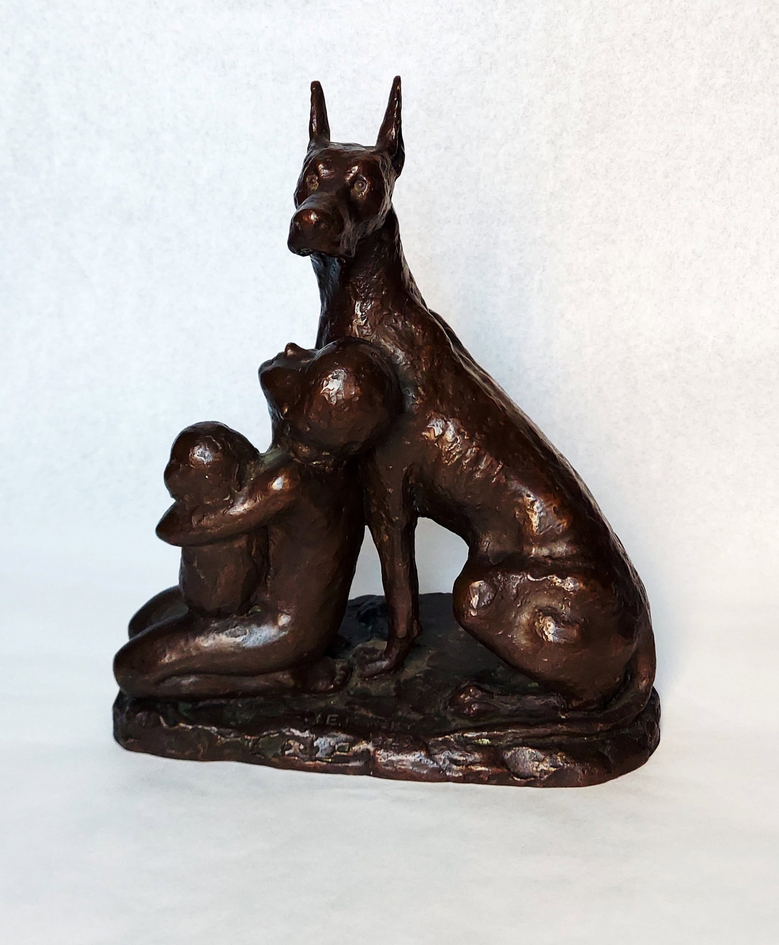 I. Edward Mansky: The Guarding Dog, 1929 Patinated Bronze: The Guarding Dog, 1929 bronze sculpture by I. Edward Mansky (American, 1912-1975). Signature of artist I. Edward Mansky is at the front base. Foundry name Roman Bronze WorksN.Y. on the base rear. Dime