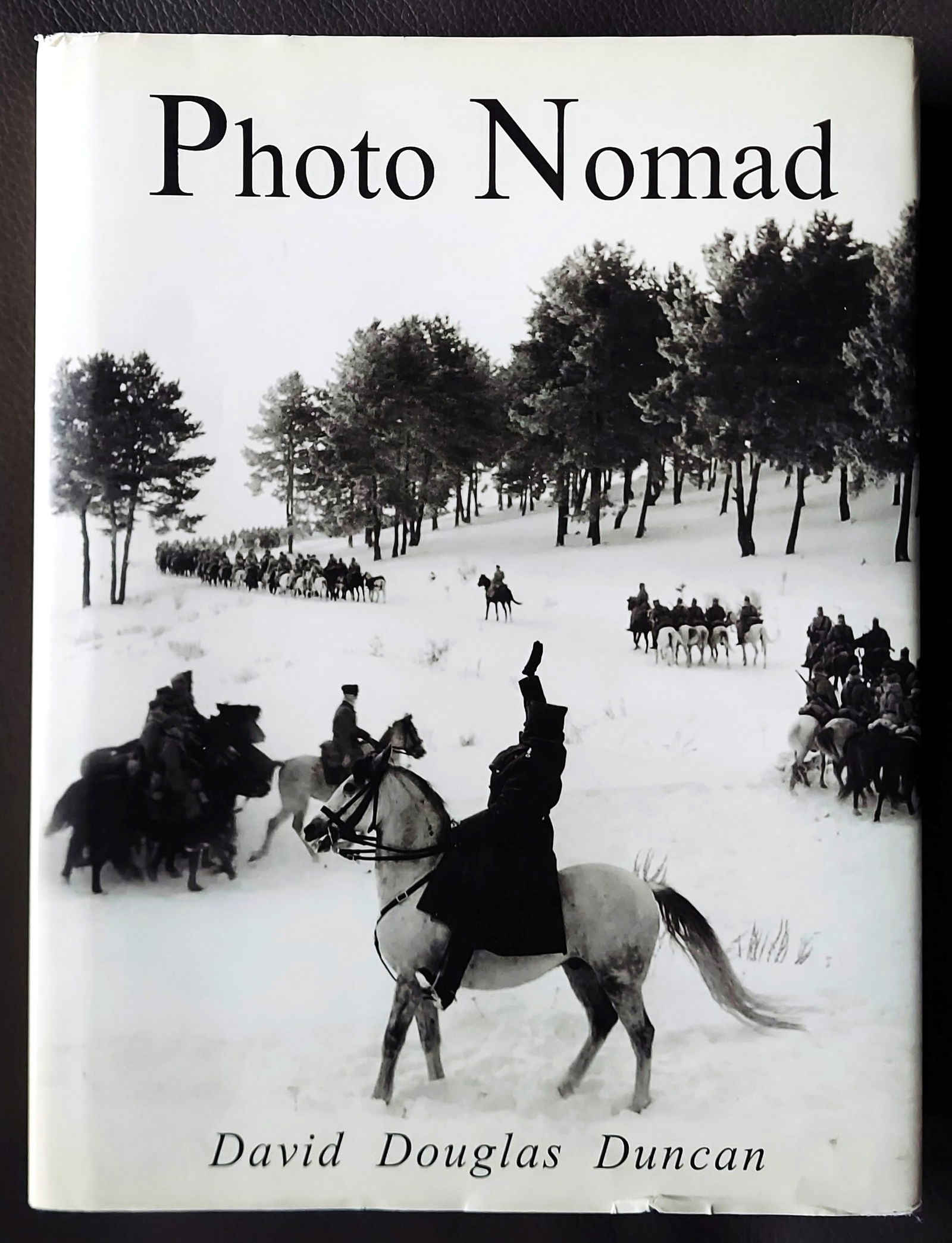 David Douglas Duncan: Photo Nomad 2003 First Edition: Photo Nomad by David Douglas Duncan (1916-2018). First Edition by W. W. Norton & Company, London, 2003. Hardcover in Royal blue cloth with embossed title on cover and gold gilt font on spine, 464 pps,