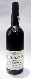1977 Taylor Fladgate Vintage Port, 750ml: Taylor Fladgate Vintage Port 750ml, 1977 Condition: Top neck, soiled labels.