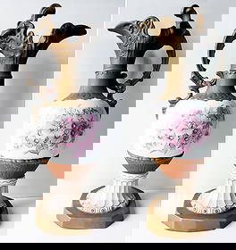 Royal Dux Art Nouveau Porcelain Ewers, Pair c.1920s: Royal Dux Ewers (2): Art Nouveau Porcelain created between 1919 - 1938. Royal Dux Bohemia ewer ovoid vases, crafted in white and dark gold porcelain with a floral decor, molded neck and spreading base