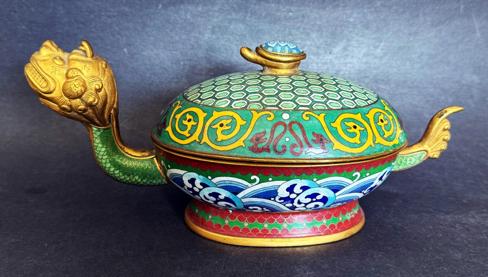 Chinese Cloisonné and Gilt Bronze Dragon Turtle Vessel: Chinese Cloisonne and Gilt Bronze Dragon Turtle Vessel. Dimensions: 11 x 5 x 5 inches. Antique Chinese cloisonné enamel lidded vessel in the form of a dragon turtle, decorated with a dragon-shape