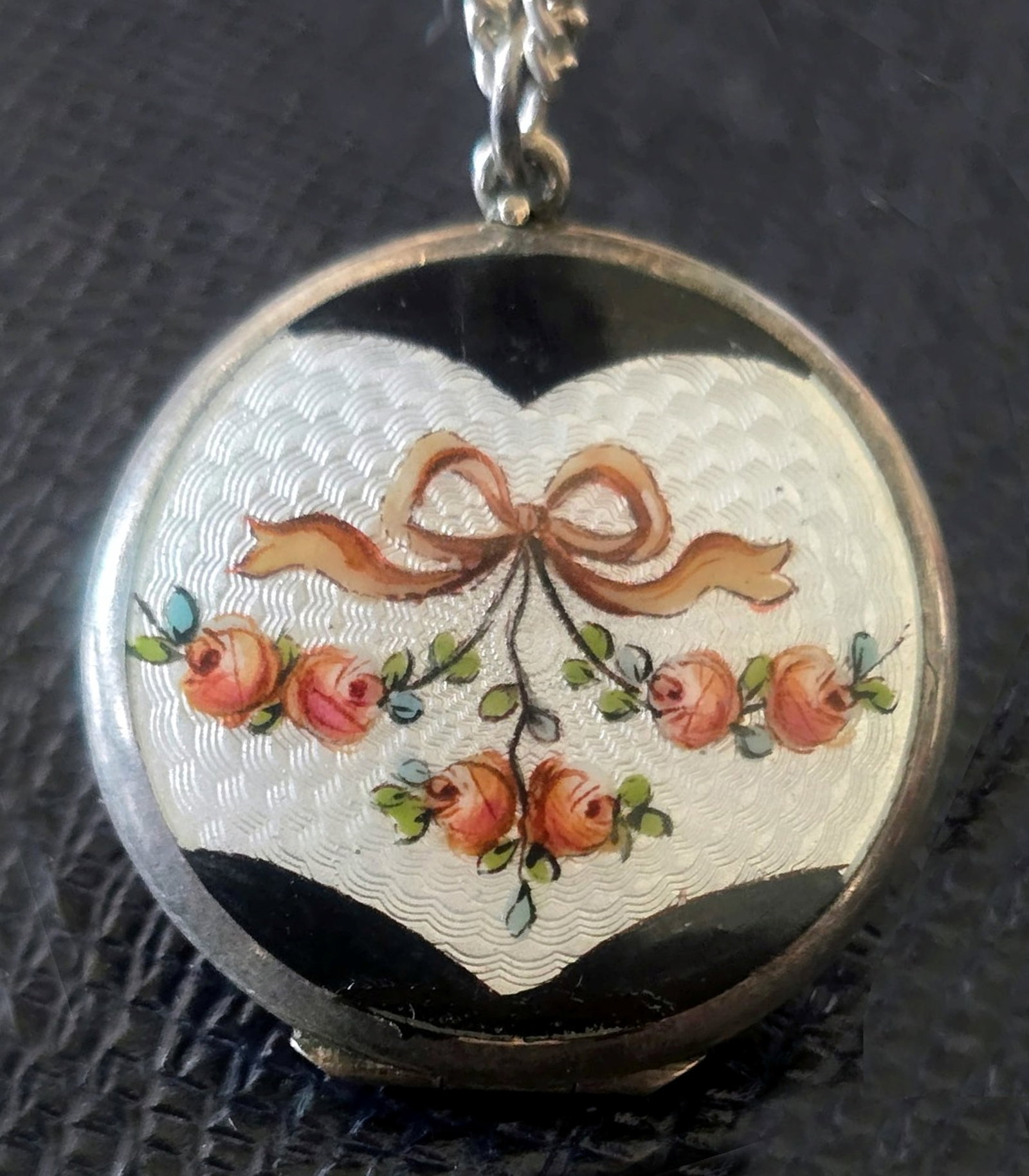 Antique Sterling Silver Blue Guilloche Enamel Locket with Roses: Antique Silver Blue Guilloche Enamel locket with painted roses and green foliage. Sterling Silver, Guilloche Enamel, Metal. Diameter 1.25 x .25 inches. Weight: Locket 7.68g, Chain 8.5g Hallmarks: Chai